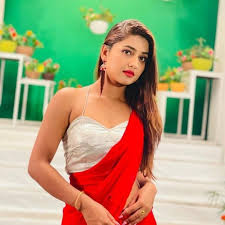 A 24 YRARS OLD CUTE GIRL IN RED AND WHITE SAREE STANDING POSITION